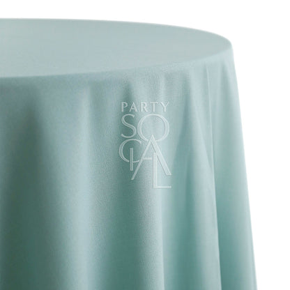 Round cotton linen tablecloth in mint green, showcasing a fresh and vibrant shade. The mint green color adds a lively and refreshing touch, perfect for brightening up any table setting.
