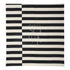 Chic rug with a classic black and white striped pattern, featuring alternating bold stripes that create a striking contrast. The rug’s clean, geometric design adds a modern and stylish touch to any room, enhancing both contemporary and minimalist decor themes.